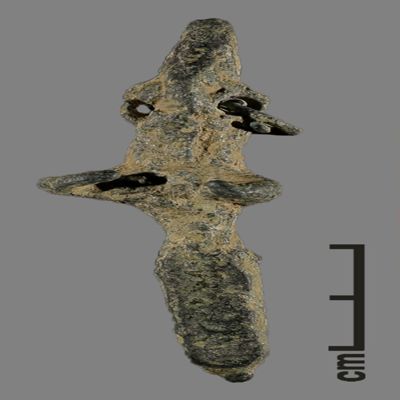 Figurine. Anthropomorphic figure with conical hat, two holes for earrings, one earring remaining, lower body ending like a peg. Bronze.; YPM BC 031113
