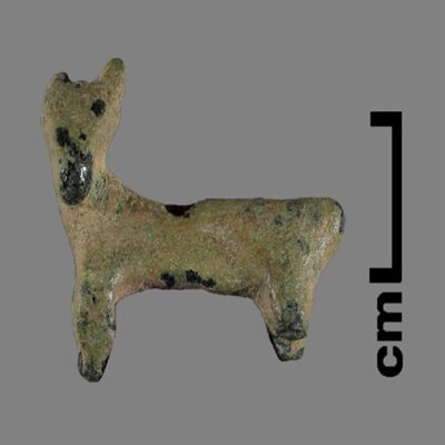 Figurine. Small quadruped with pointed ears, head turned to its left. Bronze.; YPM BC 031148