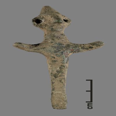 Figurine. Anthropomorphic figure with conical hat, two holes for earrings, arms spread, lower body ending like a peg. Bronze.; YPM BC 031129