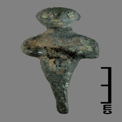 Figurine. Ithyphallic figure, right arm spread out with remains of unknown object in right hand, left arm resting on chest, lower body ending like a peg. Bronze.; YPM BC 031153