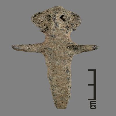 Figurine. Anthropomorhpic figure with remains of conical hat, goggle-eyed, remains of two earrings, arms spread, lower body ending like a peg. Bronze.; YPM BC 031125