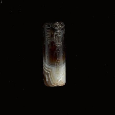 Cylinder seal. Robed, bearded figure; inscription. Kassite. Agate.; YPM BC 037173