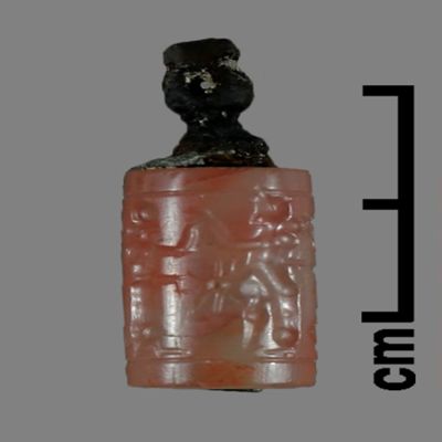 Cylinder seal. Copper pin in hole; drilled style. Neo-Assyrian?. Agate, copper.; YPM BC 026357