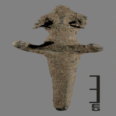 Figurine. Anthropomorphic figure with small conical hat, two earrings, arms spread, lower body ending like a peg. Bronze.; YPM BC 031118