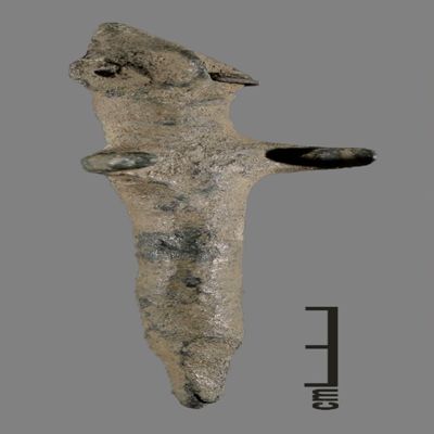 Figurine. Anthropomorphic figure with conical hat, two holes for earrings, one earring remaining, arms spread, lower body ending like a peg. Bronze.; YPM BC 031122