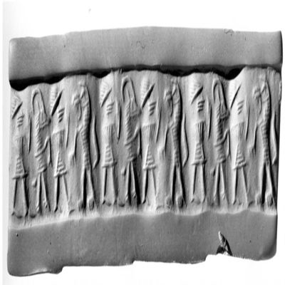 Cylinder seal. Old Assyrian style or prov. Bab. Kilted figure with rounded cap and one raised hand approaching rampant lion, kilted figure with rounded cap and one raised hand approaching rampant antelope facing away. Old Assyrian. Serpentine.; YPM BC 029863