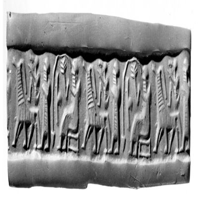 Cylinder seal. Seated figure in long dress holding drinking from vessel through a straw, figure in long dress facing monkey and horse, filling motif: ball-and-staff. Early Syrian, early 2nd mill. Serpentine.; YPM BC 029879
