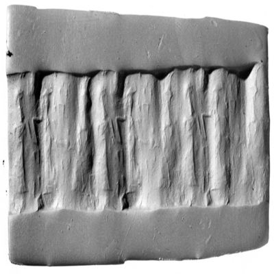 Cylinder seal. Introduction scene, worshiper led by hand towards seated figure holding vessel in raised hand. Ur III?. Lapis lazuli.; YPM BC 029873
