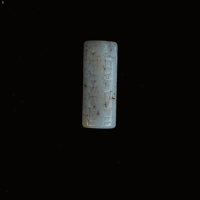 Cylinder seal. Robed, bearded figure; inscription. Kassite. Milky chalcedony.; YPM BC 037172