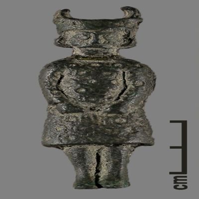 Figurine. Cast figurine of horned male in patterned dress; hands in fists on thighs. Parthian?. Bronze. metal drawer; YPM BC 023990