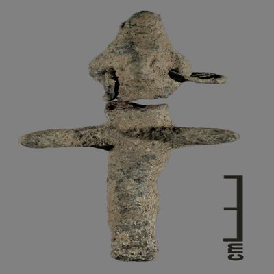 Figurine. Anthropomorphic figure with conical hat and two earrings, arms spread, lower body ending like a peg. Bronze.; YPM BC 031115