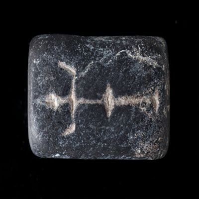 Amulet. Four sided cylinder with Anubis, snake, Iao, and standing figure. Steatite.; YPM BC 038626