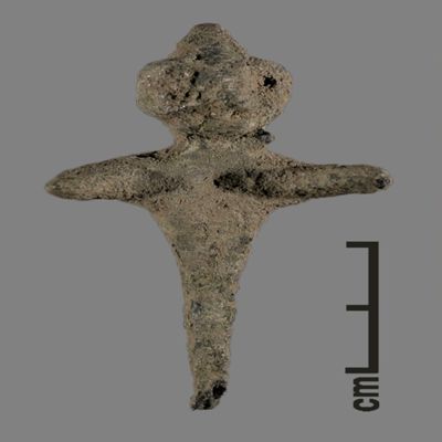 Figurine. Anthropomorphic figure with small conical hat, arms spread, lower body ending like a peg. Bronze.; YPM BC 031114