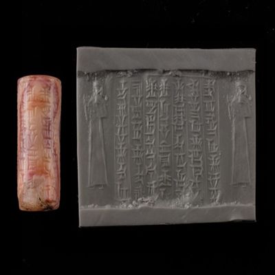 Cylinder seal. Worshipper; inscribed. First kassite style. Kassite. Pink/gray agate.; YPM BC 006184