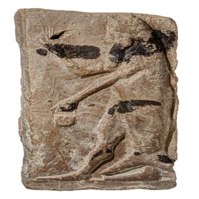 Figurine, plaque. Plaque with a fish-apkallu holding a bucket and a bundle of rays. Traces of black colour. Anepigraphic. Neo-Assyrian. Terracotta.; YPM BC 038026