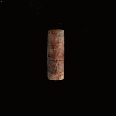 Cylinder seal. Three rows of four birds; linear dividers and borders. Kassite. Pink/red agate.; YPM BC 012350