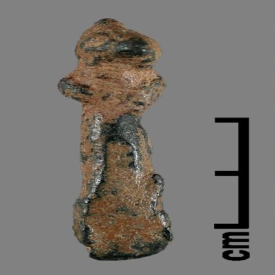 Figurine. Anthropomorphic figure with small pointed hat, joined arms, lower body ending like a peg. Bronze.; YPM BC 031150