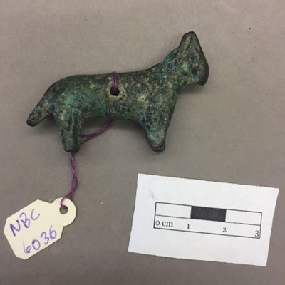 Figurine. Sheep, long body, thick short tail, two pointy ears, hole through body. Third Millenium? Bronze.; YPM BC 009017