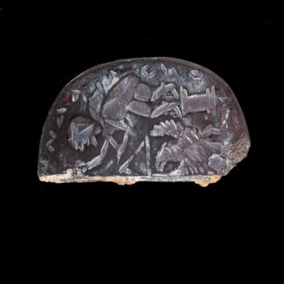 Amulet. Ob: Man with sack on pillar (Aeolus?), eagle below (right half). Rev: er...epa...ntk...yst. Hematite.; YPM BC 038593
