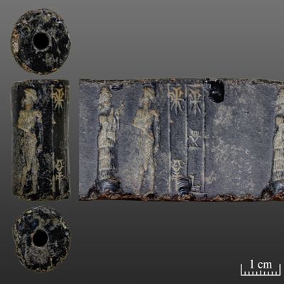 Cylinder seal. Kilted man with mace facing suppliant goddess; inscription. Old Babylonian. Obsidian.; YPM BC 009661
