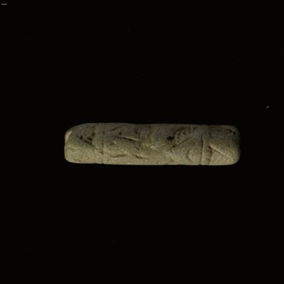 Cylinder seal. Spear, winged bull, kilted man, rhomb and wedge, crescent and star, linear and hatched triangle border. Third Kassite Style. Kassite. Limestone.; YPM BC 013948