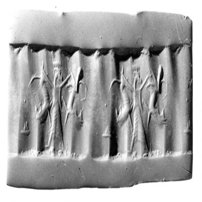 Cylinder seal. Contest, figure kilt wearing a crown holds upside-down lions in each hand. Achaemenid. Carnelian.; YPM BC 029876