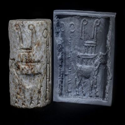 Cylinder seal, fragment. Temple with tassled standards on back of bull; two tasseled standards. Uruk IV. Marble.; YPM BC 036919