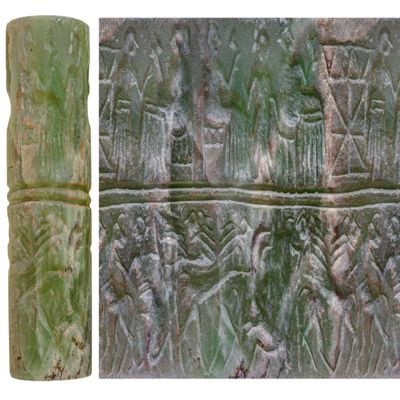 Cylinder seal. Banquet scene and contest scene; standing attendant facing seated male, seated female facing standing attendant, architecture, two-line horizontal divider, crossed lions attacking goat held by hero at left and antelope at right, second pair of crossed lions. Early Dynastic III. Green calcite.; YPM BC 008968