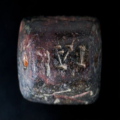Amulet. Irregular sealstone with anguipede on face, on figure on each side a Iao on top. Black stone.; YPM BC 038624