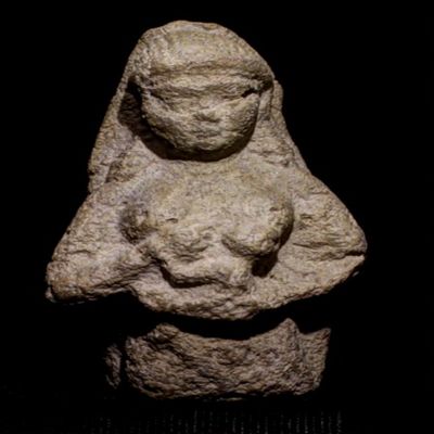 Figurine, double-mold; nude female nursing child at left breast. Her left hand holds child. Child grasps her right wrist. Braided or beaded hair swept behind ears.; YPM BC 016846