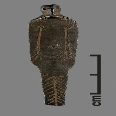 Figurine. Flat figurine with round head on top, two arms incised on torso, lower body incised with arrowhead motif. Silver.; YPM BC 031091